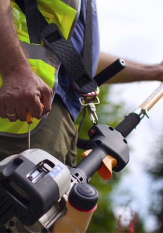 Man operating a Hedge trimmer