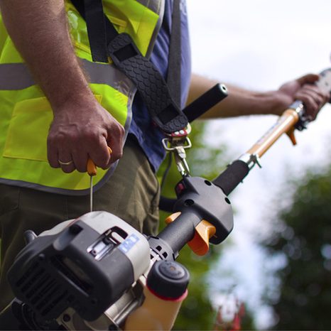 Man operating a Hedge trimmer